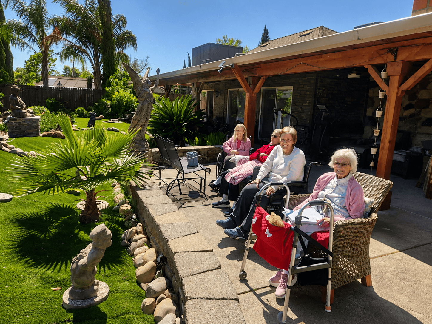 Residents enjoying sunny outdoor time at The Oaks at Garfield memory care